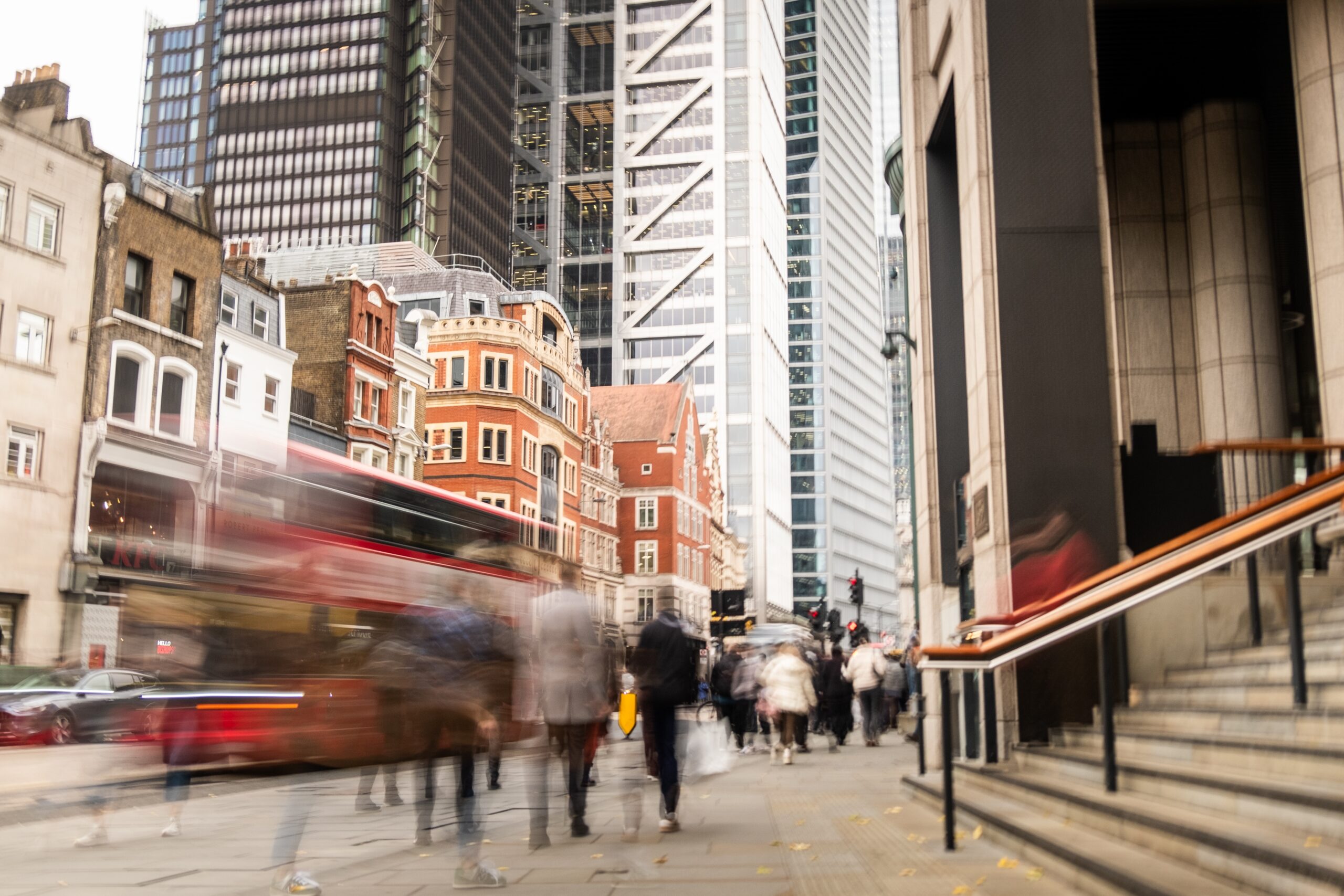 London City Street With Highrise buildings in background, traffic moving, commercial and residential buildings