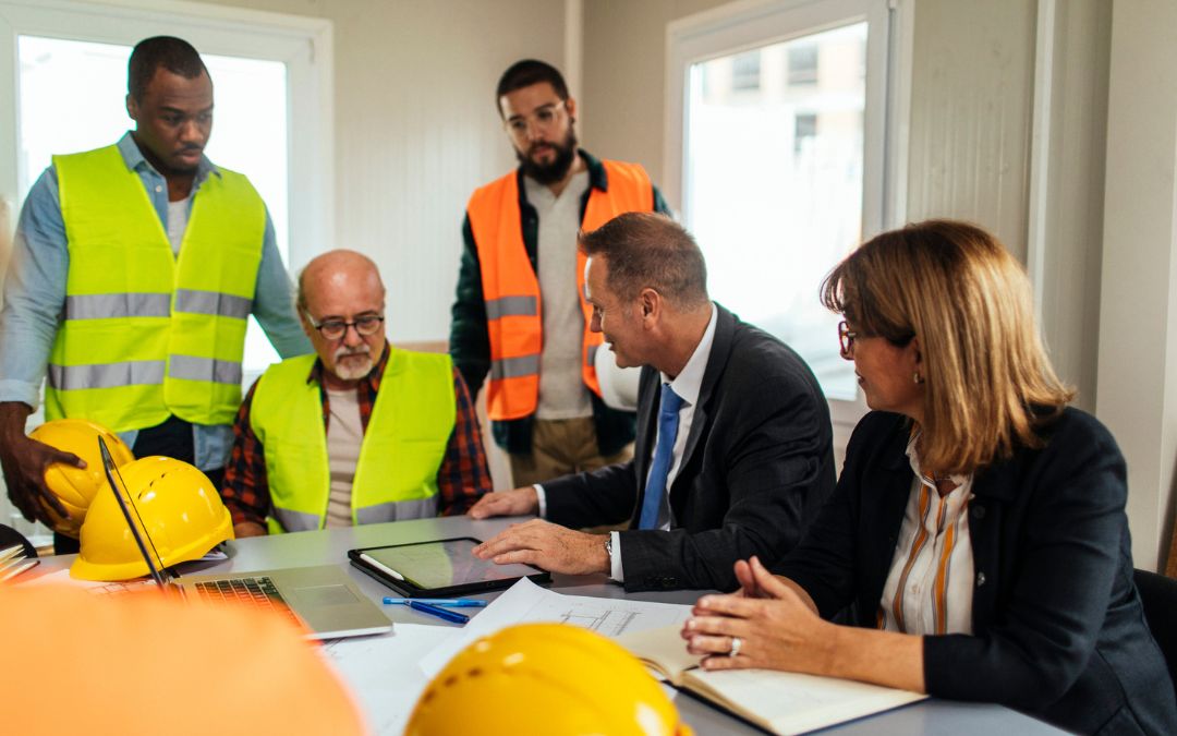 Business Meeting discussing HSE Requirements in Construction Office